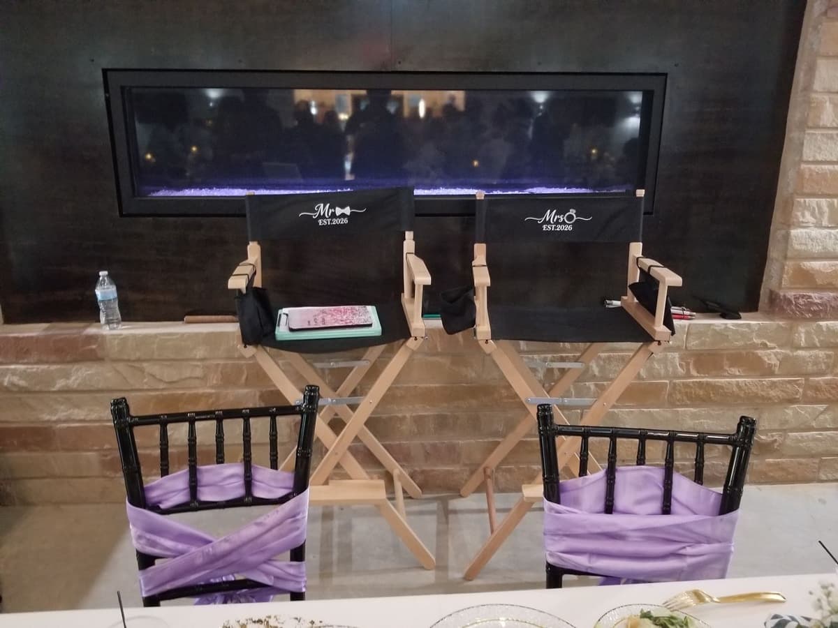 Personalized Mr. and Mrs. director's chairs beside the reception fireplace