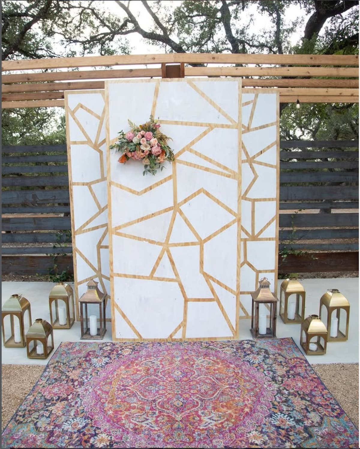 A custom floral backdrop at Prima Vista's outdoor ceremony area