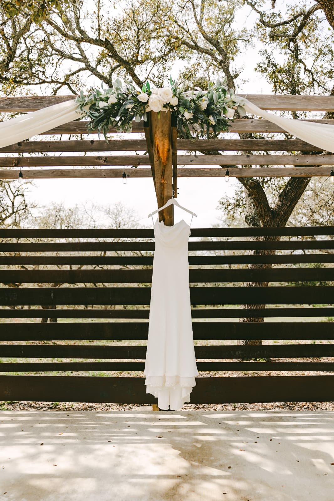 Wedding Dress beneath the Ceremony Pergola