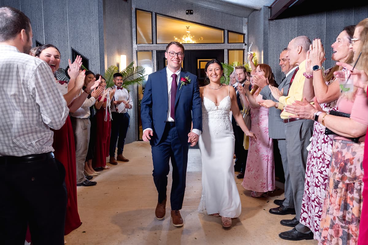 Natasha and Brian celebrate during their wedding sendoff