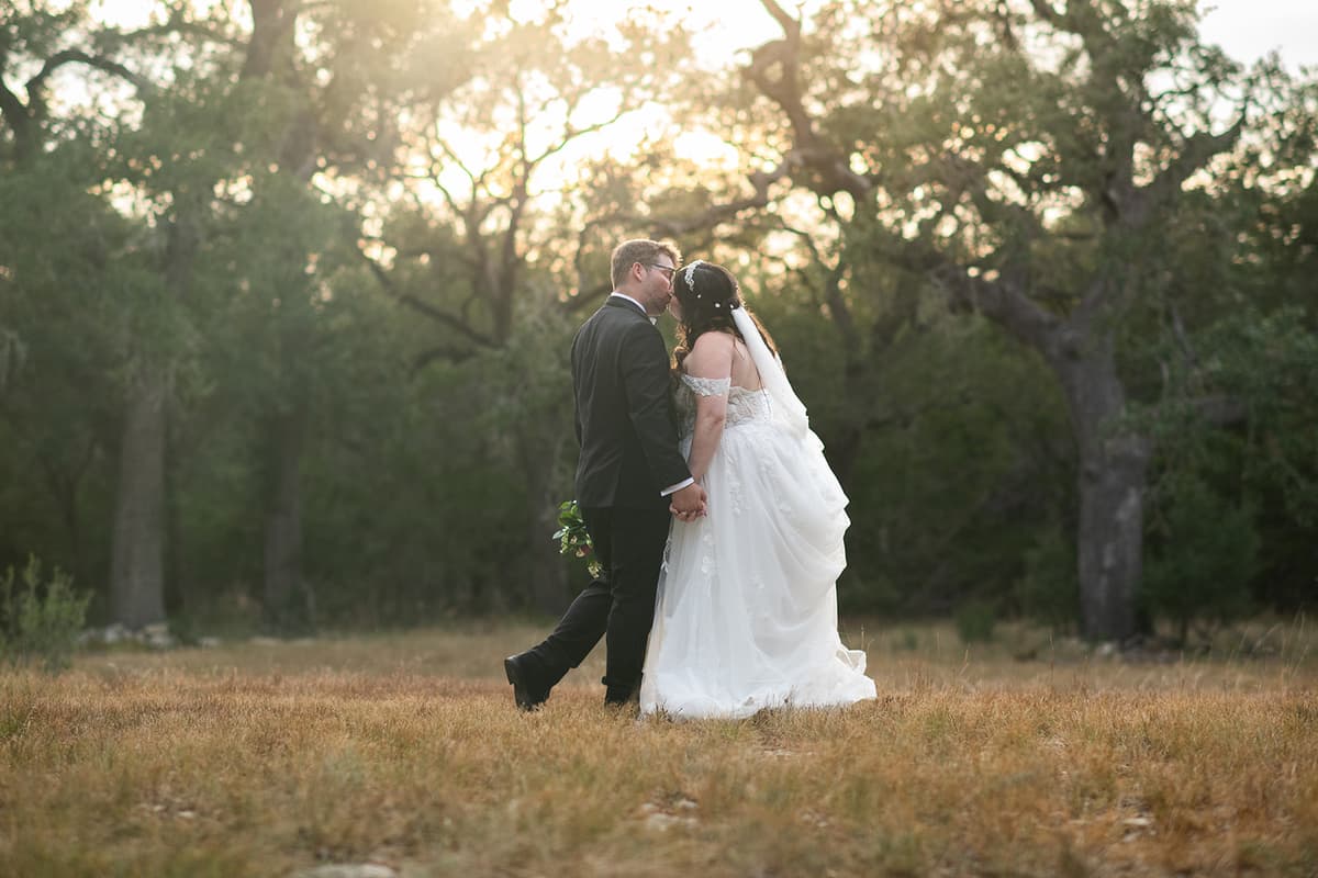 Nicole and Dylan share a quiet golden-hour moment in the Texas Hill Country