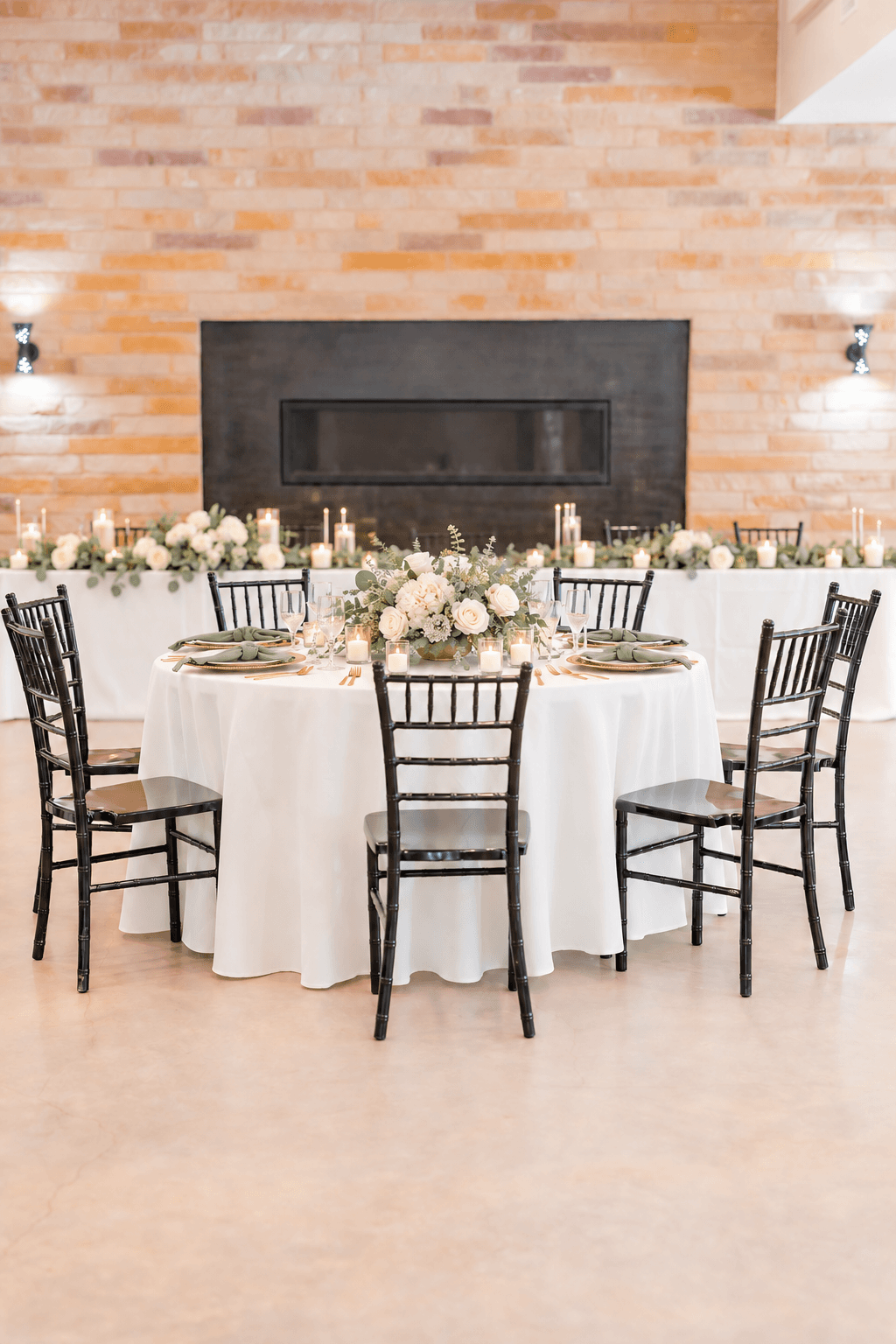 Sage napkins and white florals on a champagne table