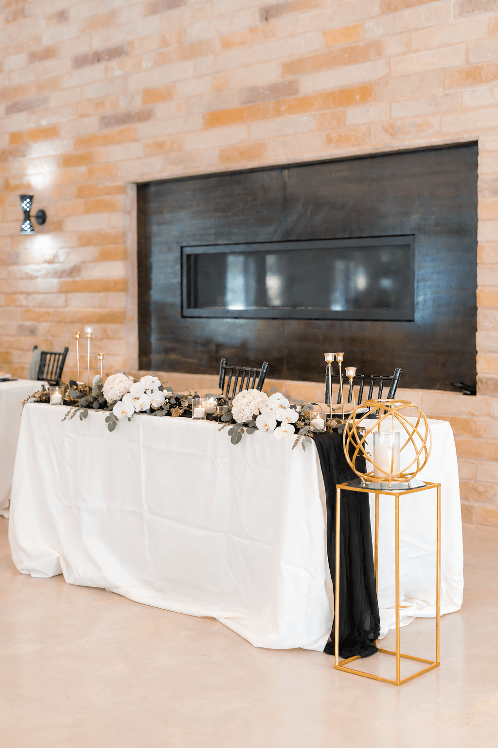 Modern black-and-white sweetheart-table styling