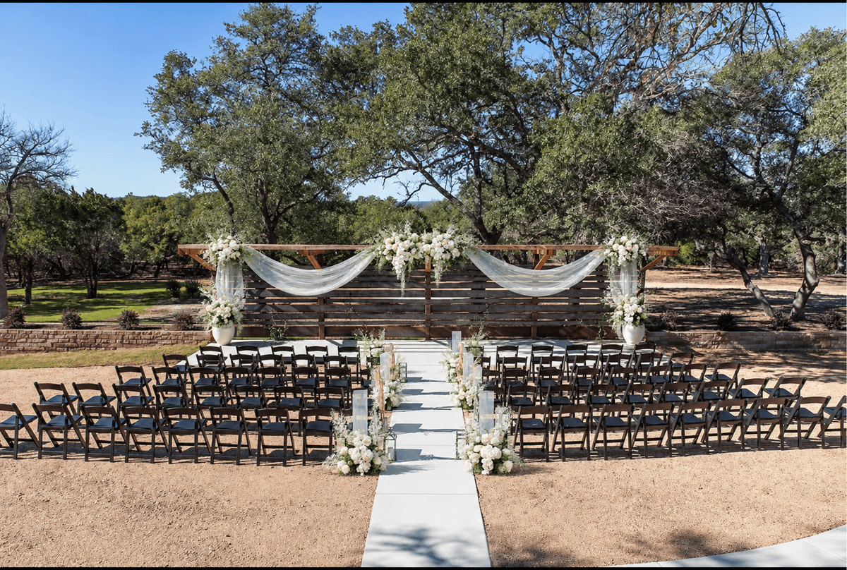 Opalescent Modern outdoor ceremony with sculptural white flowers