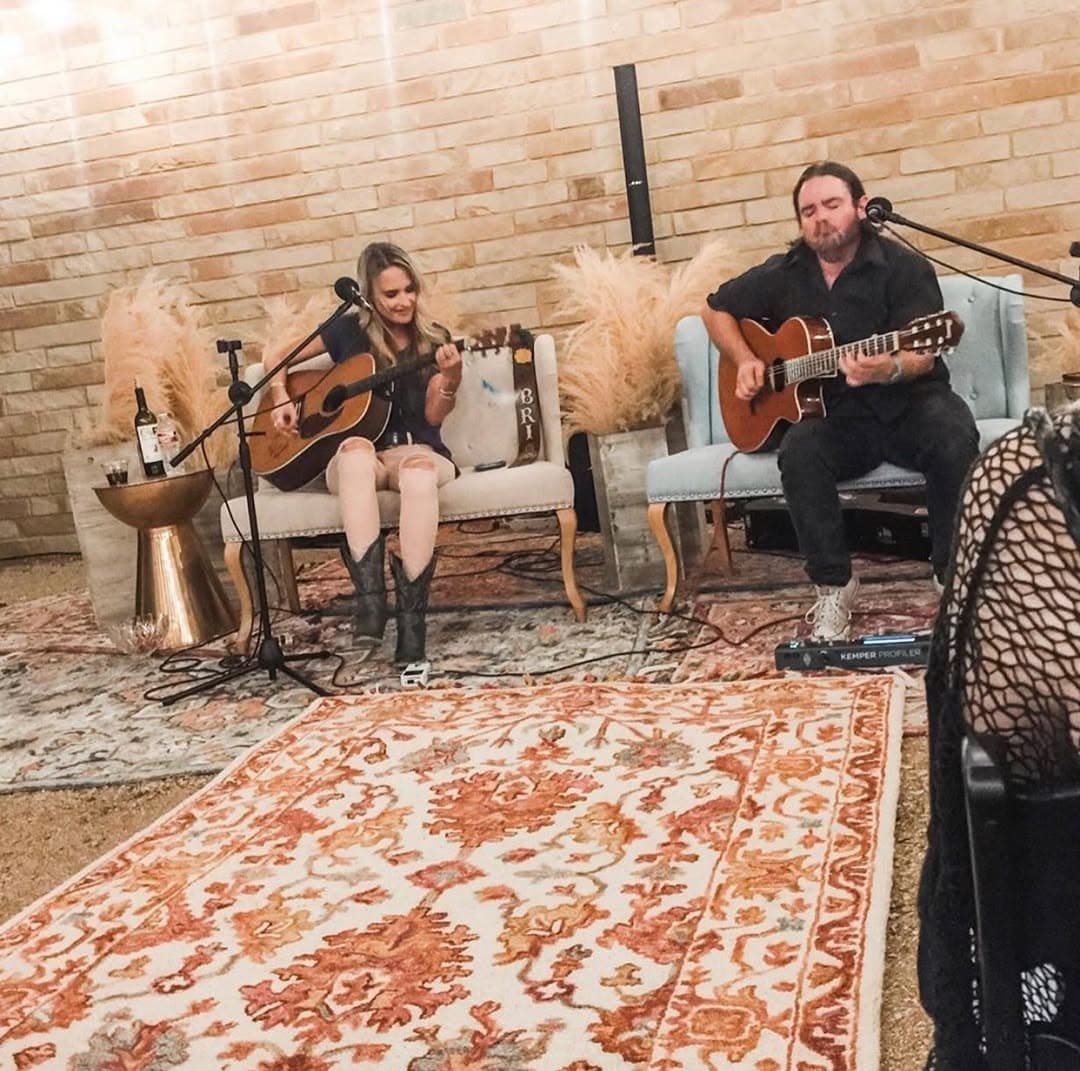 Live acoustic duo performing at a Prima Vista reception